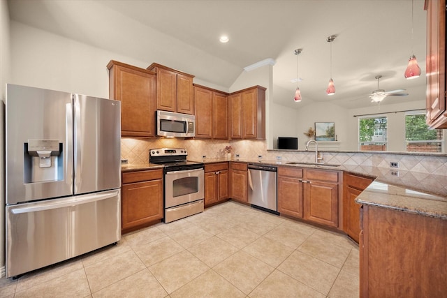 1224 Shelley Dr, Burleson, TX 76028 - kitchen featuring appliances with stainless steel finishes, lofted ceiling, brown cabinets, stone counters, and backsplash