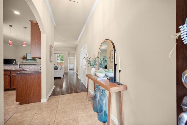 1224 Shelley Dr, Burleson, TX 76028 - hall featuring arched walkways, light tile patterned flooring, and ornamental molding