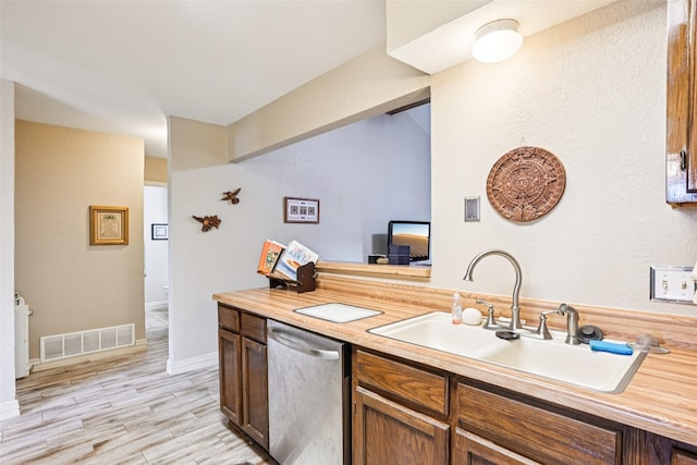 406 Anice Ln, Euless, TX 76039 - kitchen with dishwasher, light wood-type flooring, and wooden counters