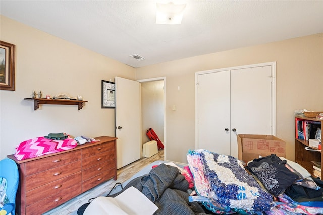 406 Anice Ln, Euless, TX 76039 - bedroom featuring wood finished floors and a closet
