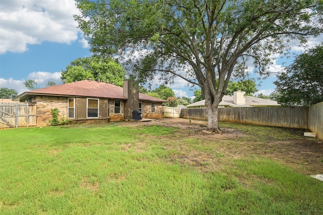 406 Anice Ln, Euless, TX 76039 - back of property with a fenced backyard and a chimney