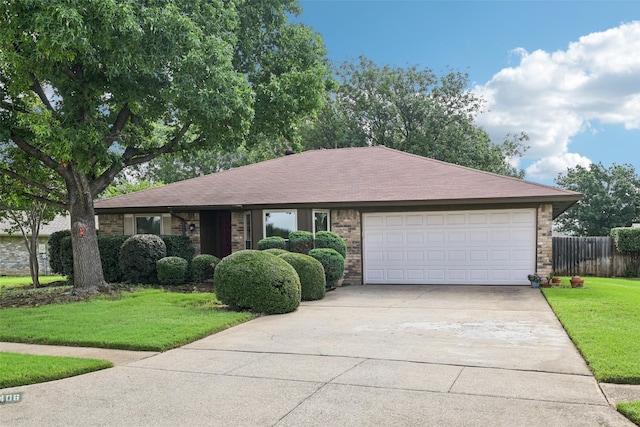 406 Anice Ln, Euless, TX 76039 - ranch-style house featuring driveway, a garage, brick siding, and roof with shingles