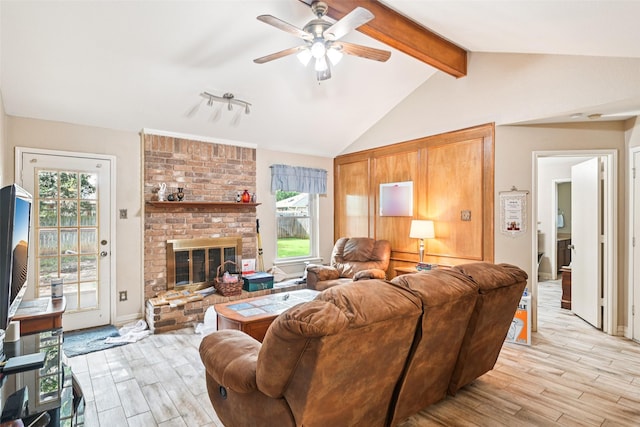 406 Anice Ln, Euless, TX 76039 - living room featuring light wood finished floors, a ceiling fan, and a brick fireplace