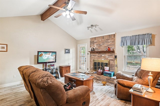406 Anice Ln, Euless, TX 76039 - living area with wood finished floors, a ceiling fan, and a fireplace