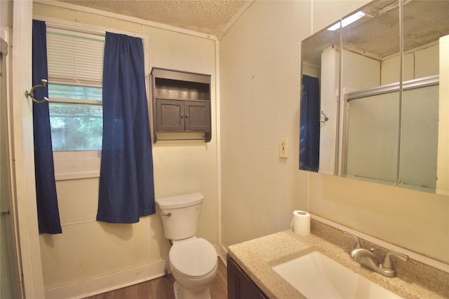 214 Fenton St, Waco, TX 76705 - bathroom featuring vanity, wood finished floors, and a textured ceiling