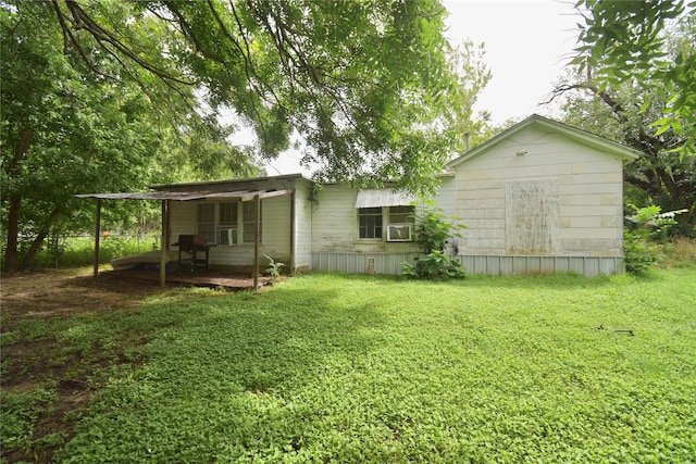 214 Fenton St, Waco, TX 76705 - back of house with a lawn and cooling unit