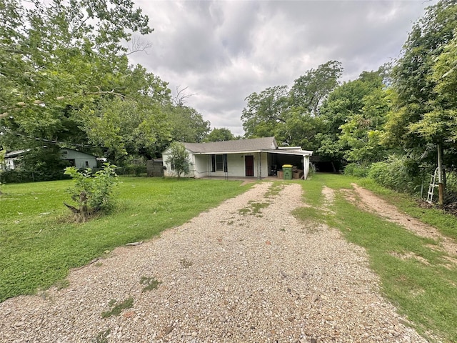 214 Fenton St, Waco, TX 76705 - view of front facade with dirt driveway, a front lawn, and covered porch