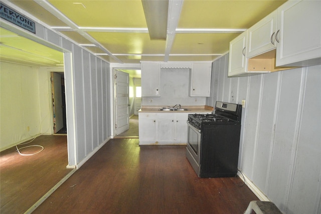 214 Fenton St, Waco, TX 76705 - kitchen featuring stainless steel range with gas cooktop, dark wood-type flooring, white cabinets, and light countertops