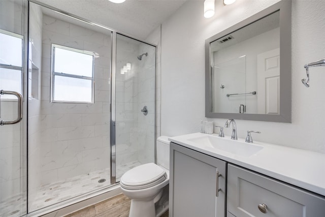 162 Aztec Dr, Mabank, TX 75156 - full bathroom featuring a shower stall, vanity, and wood finished floors