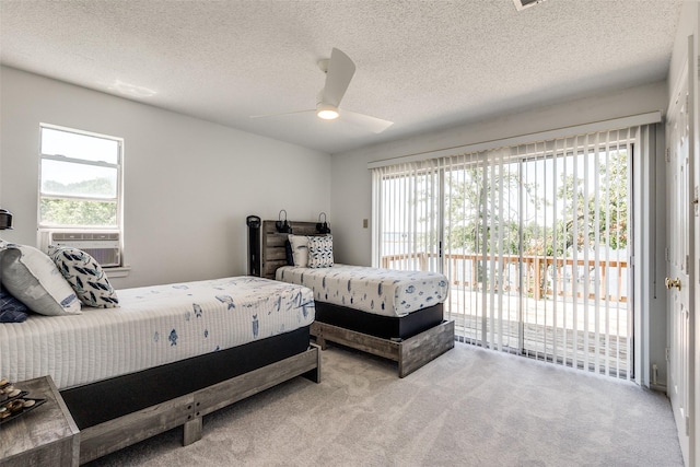 162 Aztec Dr, Mabank, TX 75156 - bedroom featuring access to outside, carpet floors, multiple windows, and a textured ceiling