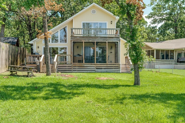 162 Aztec Dr, Mabank, TX 75156 - back of house with a sunroom, a balcony, a fenced backyard, and a deck