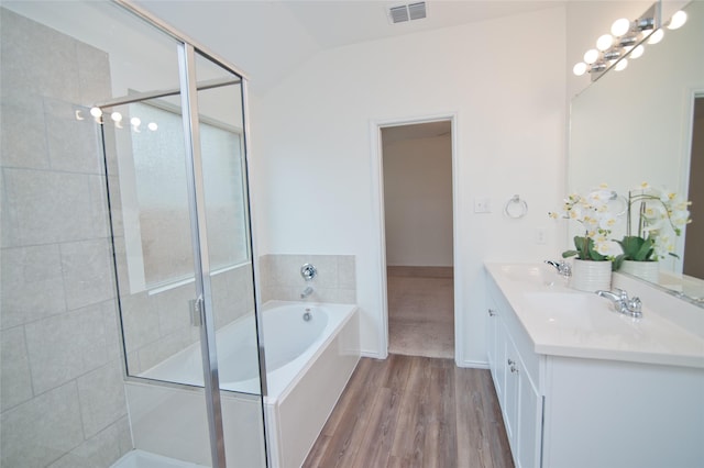 3913 Great Plains Way, Forney, TX 75126 - full bath featuring double vanity, a bath, tiled shower, wood finished floors, and lofted ceiling