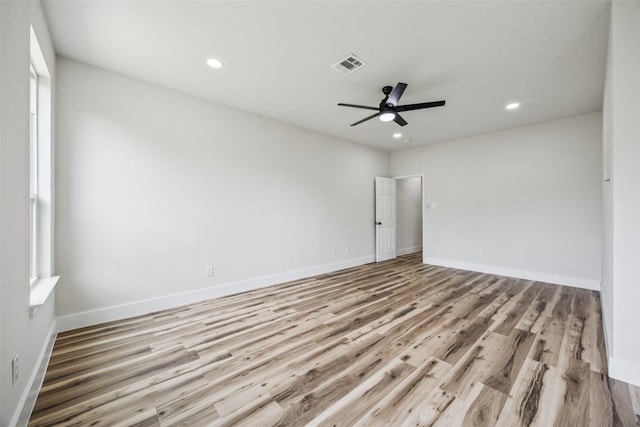 15578 Wrangler Dr, Frisco, TX 75035 - empty room featuring a ceiling fan, recessed lighting, wood finished floors, and plenty of natural light