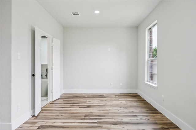 15578 Wrangler Dr, Frisco, TX 75035 - empty room with wood finished floors and recessed lighting