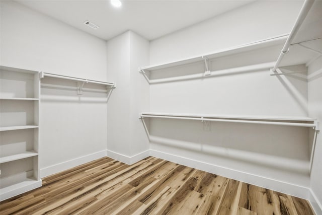 15578 Wrangler Dr, Frisco, TX 75035 - spacious closet featuring wood finished floors