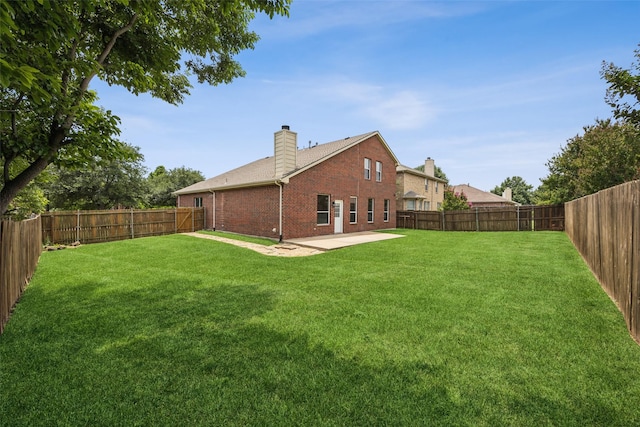 15578 Wrangler Dr, Frisco, TX 75035 - fenced backyard with a patio area