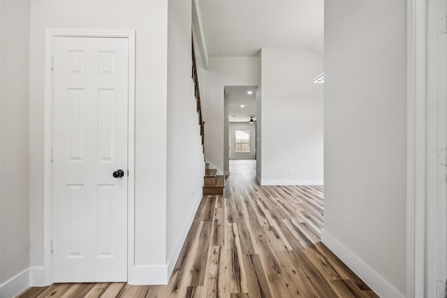 15578 Wrangler Dr, Frisco, TX 75035 - corridor with wood finished floors and stairs