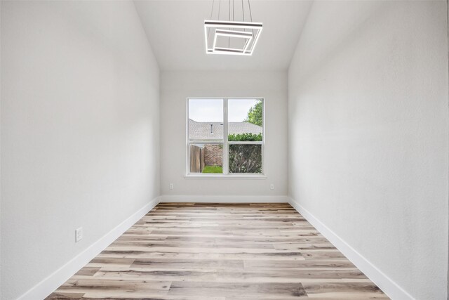 15578 Wrangler Dr, Frisco, TX 75035 - unfurnished room featuring lofted ceiling and wood finished floors