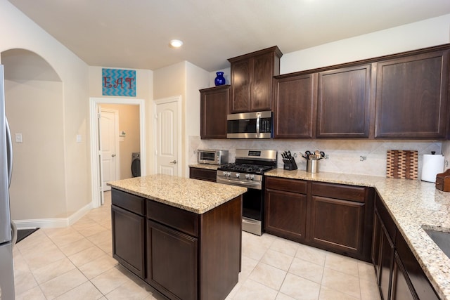 3508 Cooke Ln, Melissa, TX 75454 - kitchen with stainless steel appliances, light tile patterned floors, backsplash, and recessed lighting