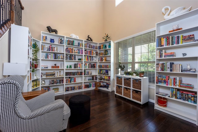 3508 Cooke Ln, Melissa, TX 75454 - living area featuring wood finished floors and wall of books