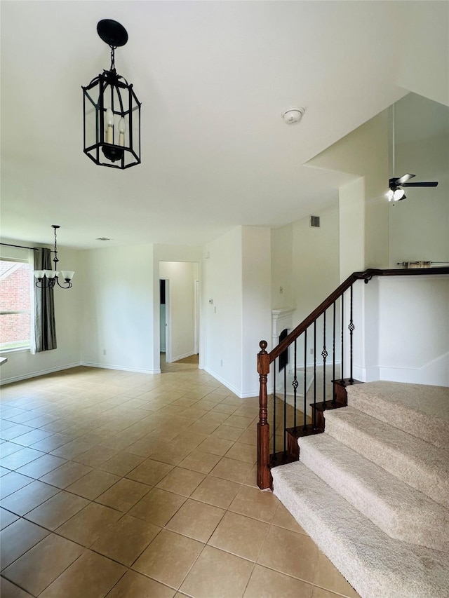 639 Austin Ln, Lavon, TX 75166 - staircase featuring tile patterned flooring and a chandelier