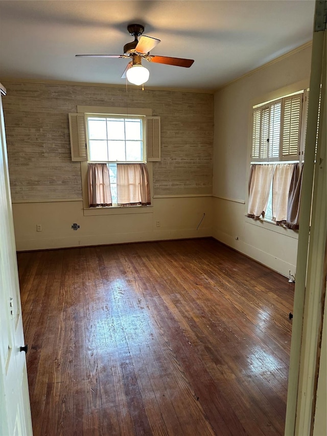 509 E Main St, Mexia, TX 76667 - spare room with wood finished floors and a ceiling fan