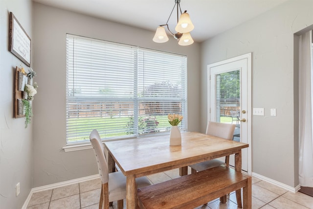 8508 Forsythia Dr, Mckinney, TX 75072 - dining area featuring light tile patterned floors, healthy amount of natural light, and a chandelier