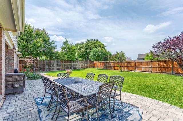 8508 Forsythia Dr, Mckinney, TX 75072 - fenced backyard with a patio area and outdoor dining space