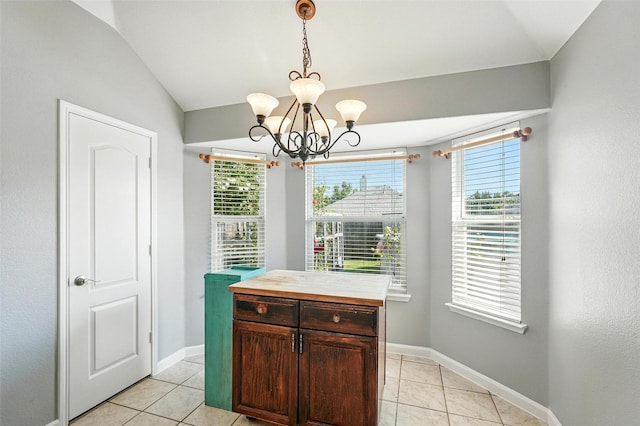 9212 Bedford Ln, Mckinney, TX 75071 - dining space with light tile patterned floors, a chandelier, plenty of natural light, and lofted ceiling