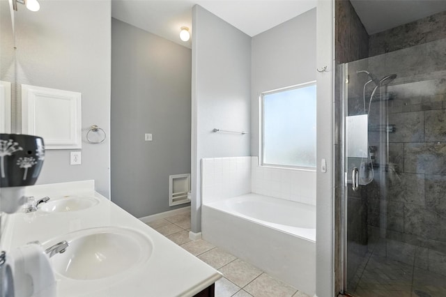9212 Bedford Ln, Mckinney, TX 75071 - full bathroom with tile patterned floors, a bath, a shower stall, and double vanity
