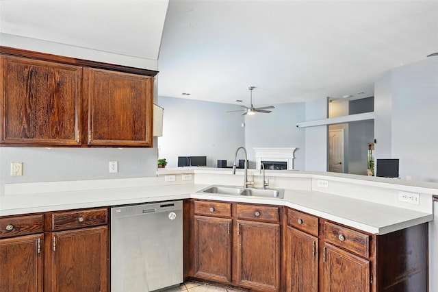 9212 Bedford Ln, Mckinney, TX 75071 - kitchen featuring stainless steel dishwasher, ceiling fan, a peninsula, a fireplace, and light countertops