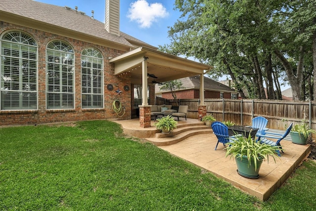 4321 Hazy Meadow Ln, Grapevine, TX 76051 - fenced backyard with a ceiling fan, a patio, and outdoor lounge area
