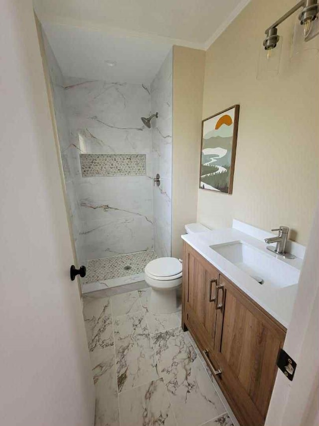 4737 Lawler Rd, Garland, TX 75042 - full bath featuring marble look tile flooring, a marble finish shower, vanity, and ornamental molding