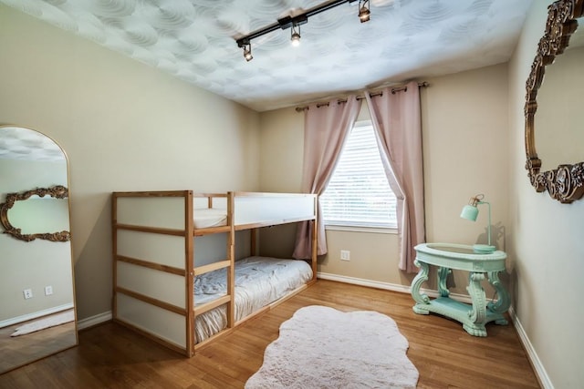 4737 Lawler Rd, Garland, TX 75042 - bedroom with wood finished floors