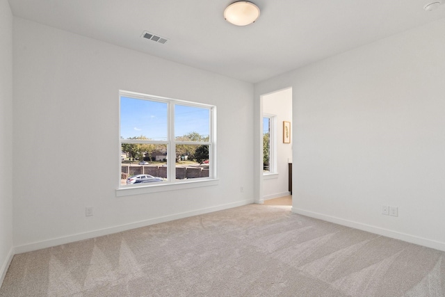 2142 Oak Haven Ct, Garland, TX 75044 - unfurnished room with light carpet and baseboards