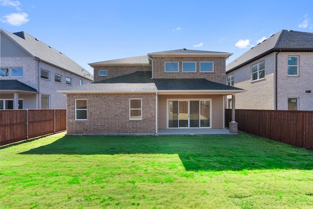 2142 Oak Haven Ct, Garland, TX 75044 - back of house with a fenced backyard, brick siding, and a shingled roof