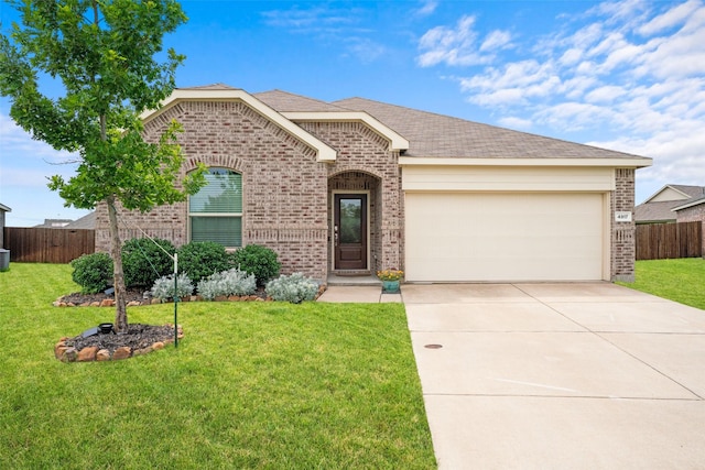 4917 Woodloch Dr, Princeton, TX 75407 - view of front facade featuring brick siding, concrete driveway, a garage, and roof with shingles