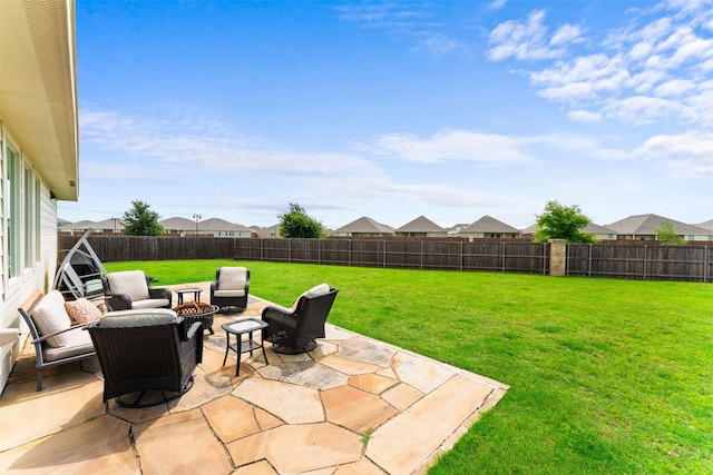 4917 Woodloch Dr, Princeton, TX 75407 - fenced backyard with a fire pit and a patio area