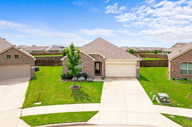4917 Woodloch Dr, Princeton, TX 75407 - view of front facade with driveway, brick siding, a residential view, and a garage
