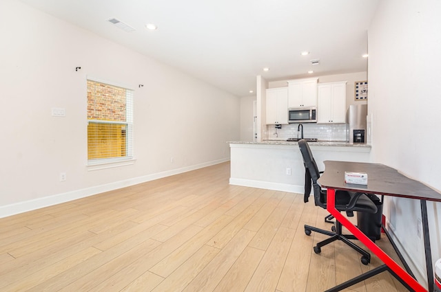 1103 Witherspoon Ln, Princeton, TX 75407 - office area featuring light wood-type flooring and recessed lighting