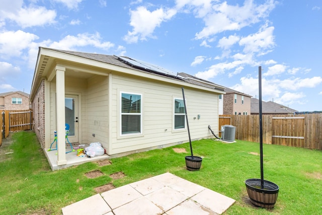 1103 Witherspoon Ln, Princeton, TX 75407 - rear view of house with a patio area, solar panels, and a fenced backyard