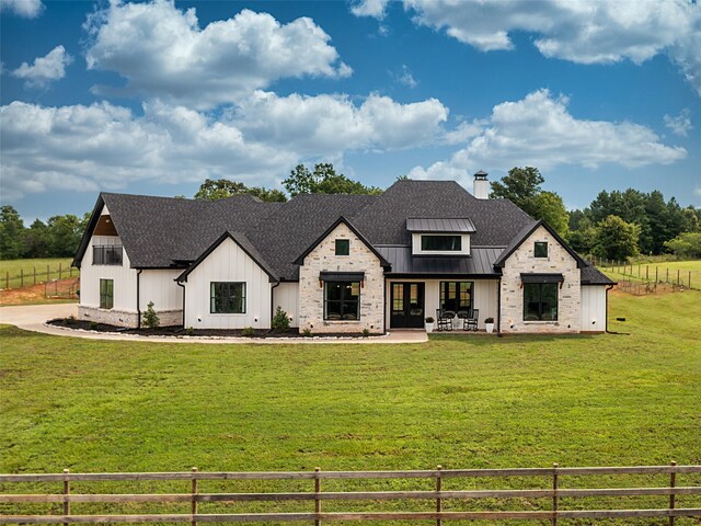 16652 Caeli Heights Ct, Winona, TX 75792 - modern farmhouse style home featuring a standing seam roof, board and batten siding, a chimney, a metal roof, and a patio area