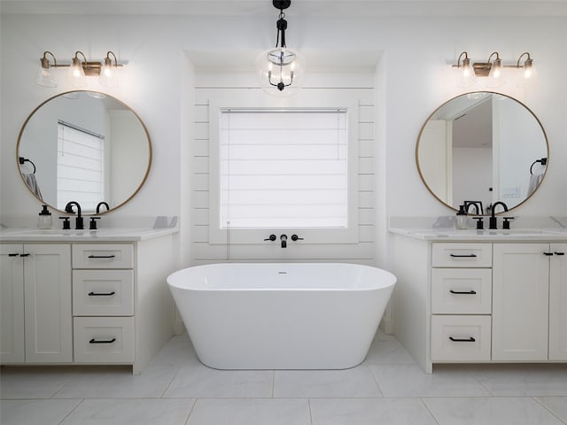 16652 Caeli Heights Ct, Winona, TX 75792 - bathroom featuring two vanities and a soaking tub