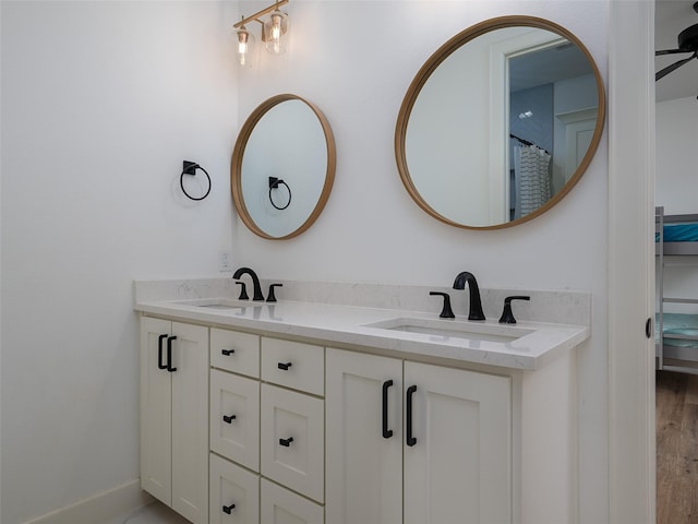 16652 Caeli Heights Ct, Winona, TX 75792 - bathroom featuring double vanity and wood finished floors