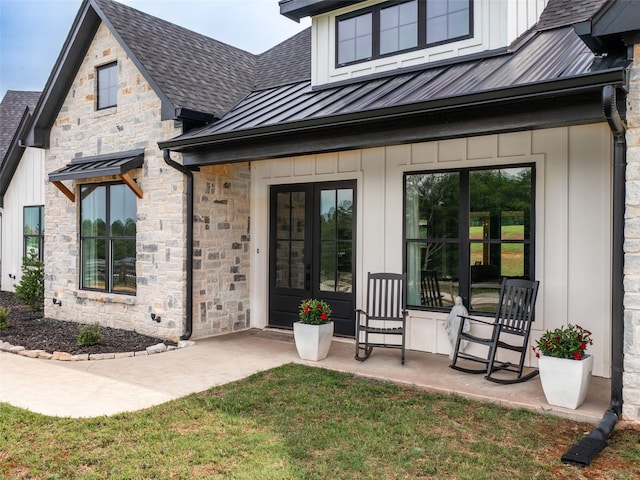 16652 Caeli Heights Ct, Winona, TX 75792 - entrance to property with a standing seam roof, french doors, roof with shingles, stone siding, and a metal roof