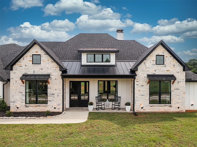 16652 Caeli Heights Ct, Winona, TX 75792 - view of front of property with stone siding, a standing seam roof, board and batten siding, and a front yard