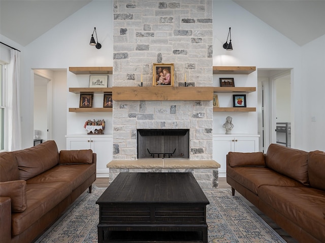 16652 Caeli Heights Ct, Winona, TX 75792 - living room with high vaulted ceiling, a fireplace, and wood finished floors