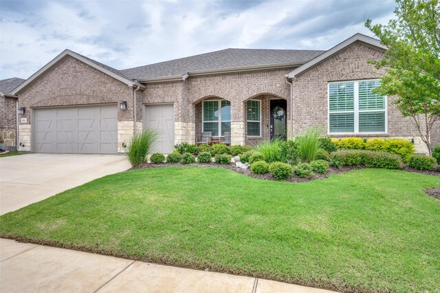1116 Cornerstone Dr, Little Elm, TX 76227 - french provincial home featuring brick siding, a front lawn, an attached garage, and driveway