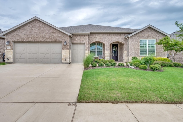 1116 Cornerstone Dr, Little Elm, TX 76227 - french country inspired facade with brick siding, concrete driveway, and a front lawn