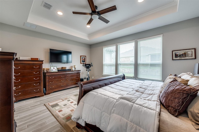 1116 Cornerstone Dr, Little Elm, TX 76227 - bedroom featuring a raised ceiling, light wood-style floors, crown molding, recessed lighting, and a ceiling fan